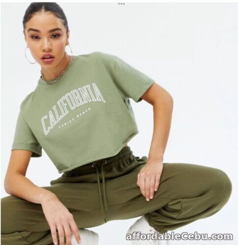 1st picture of New Look - Khaki ‘California’ Print Logo Crop Top - Size 10 - BNWT For Sale in Cebu, Philippines