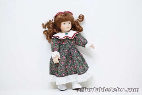 1st picture of Small Porcelain doll with old style floral dress For Sale in Cebu, Philippines