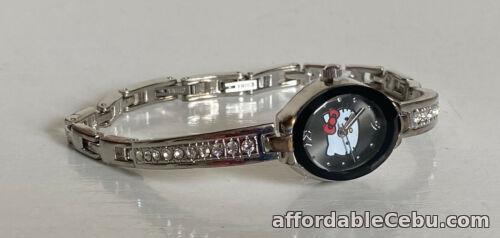 1st picture of NEW! SANRIO HELLO KITTY SILVER BANGLE BLACK DIAL CRYSTALS WATCH HK1885 SALE For Sale in Cebu, Philippines