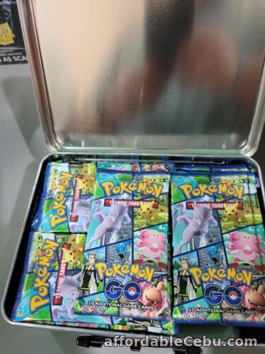 1st picture of 72x Pokemon TCG GO Booster Packs  Factory Sealed & Tin For Sale in Cebu, Philippines