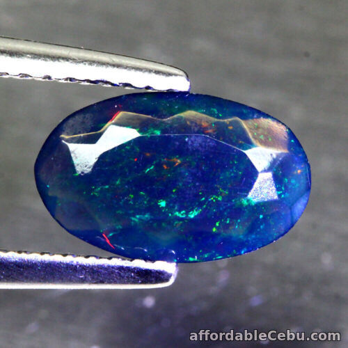 1st picture of 0.89 Carat NATURAL Bluish Fire Black OPAL for Setting Oval Facet 10x6x3mm Loose For Sale in Cebu, Philippines
