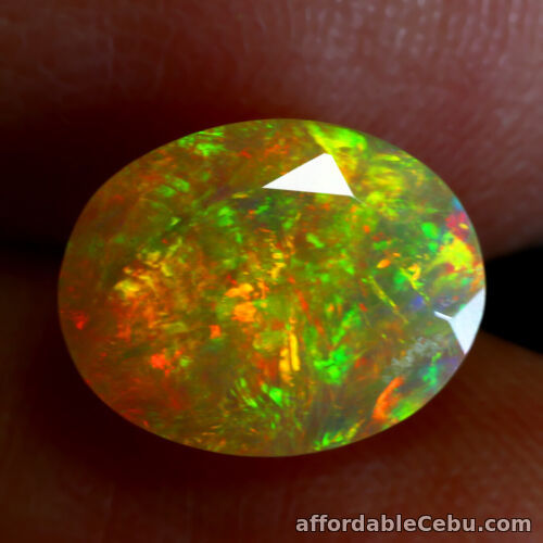 1st picture of 1.21 Carats 9.37x7.43mm Oval NATURAL OPAL Multi Color Rainbow Oval for Setting For Sale in Cebu, Philippines