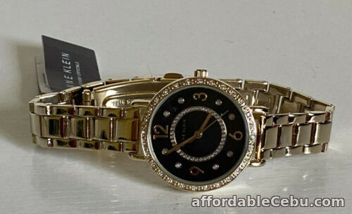 1st picture of NEW ANNE KLEIN AK SWAROVSKI CRYSTALS ACCENTED BLACK DIAL GOLD BRACELET WATCH $85 For Sale in Cebu, Philippines