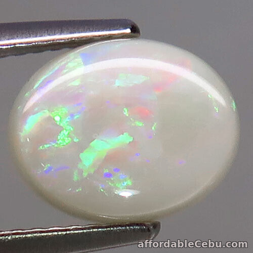1st picture of 2.30 Carats 10x8.4x4mm NATURAL Multi-Color White OPAL Loose Oval Cab Ethiopia For Sale in Cebu, Philippines