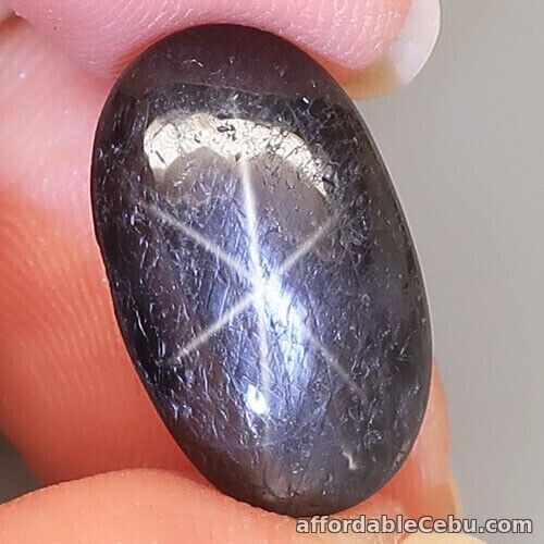 1st picture of 6.80 Carats Natural Star SAPPHIRE 6 Rays Black 15.7x9.5X4.3mm Oval Cab UNHEATED For Sale in Cebu, Philippines