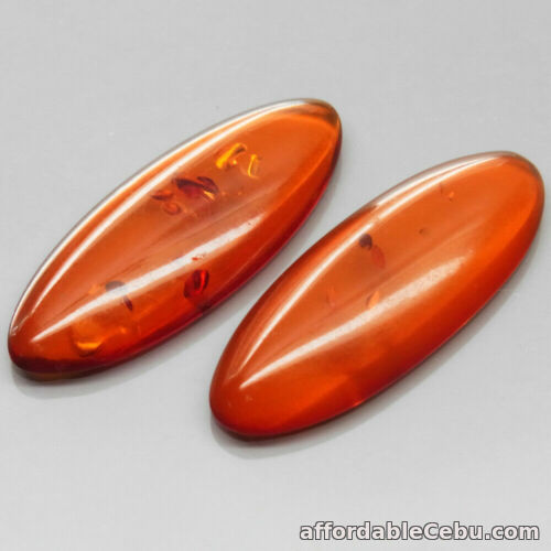 1st picture of 7.01 Carats Pair Natural Rich Orange AMBER Poland Marquise Cabochon 30x12mm For Sale in Cebu, Philippines