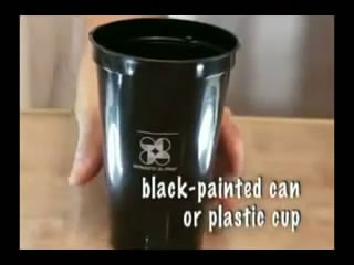 Black-painted can or black plastic cup